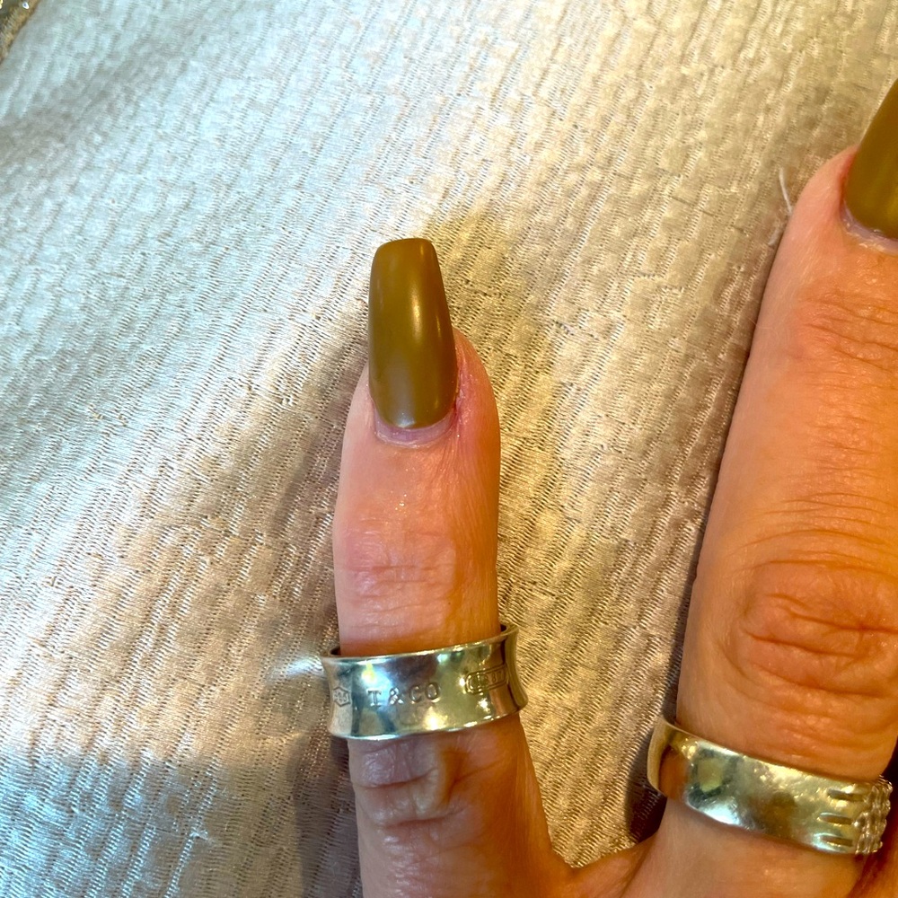 Tiffany and Company pinky ring stamped on the inside and‎ the outside